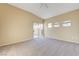 Carpeted main bedroom features a sliding glass door and vaulted ceilings at 713 Chase Tree St, Las Vegas, NV 89144