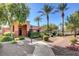 Inviting exterior of a community building showcasing lush landscaping, palm trees, and a welcoming entrance at 713 Chase Tree St, Las Vegas, NV 89144