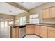 Bright kitchen offers stainless steel dishwasher, tile floors, and granite countertops at 713 Chase Tree St, Las Vegas, NV 89144
