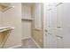 This walk-in closet features built-in shelving with rods and carpeting at 713 Chase Tree St, Las Vegas, NV 89144