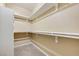 This walk-in closet features built-in shelving and carpeting at 713 Chase Tree St, Las Vegas, NV 89144