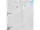 Bright, modern shower with dual shower heads and sleek, white tile at 717 Monroe Hill Pl, Henderson, NV 89011