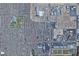 Overhead aerial of a dense suburban neighborhood, revealing street patterns, local businesses, and residential communities at 7226 Freedom Ring St, Las Vegas, NV 89148