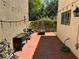 Cozy backyard patio featuring pavers and an array of potted plants for a relaxing outdoor space at 7226 Freedom Ring St, Las Vegas, NV 89148