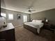 Spacious bedroom with a comfortable bed, dresser, and windows with plantation shutters at 7226 Freedom Ring St, Las Vegas, NV 89148