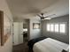 Bright bedroom with a queen bed, modern ceiling fan, and plantation shutters at 7226 Freedom Ring St, Las Vegas, NV 89148