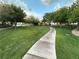 Lush green community park featuring mature trees, winding walkways, seating, and meticulously maintained landscaping at 7226 Freedom Ring St, Las Vegas, NV 89148