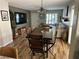 Open concept living and dining area with hardwood flooring and large windows at 7226 Freedom Ring St, Las Vegas, NV 89148