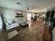 Open-concept living area with wood-look flooring, connecting to the dining and kitchen areas at 7226 Freedom Ring St, Las Vegas, NV 89148