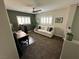 Inviting living space with comfortable seating, desk, and natural light from shuttered windows at 7226 Freedom Ring St, Las Vegas, NV 89148