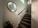 Staircase with carpeted steps and a dark handrail, leading upstairs at 7226 Freedom Ring St, Las Vegas, NV 89148