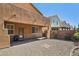 The backyard features gravel landscaping, with a covered patio area extending the living space outdoors for relaxation and enjoyment at 7407 Bakewell Ave, Las Vegas, NV 89179