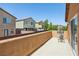 This balcony features an open patio, with sliding glass door, and workout equipment, offering neighborhood views at 7407 Bakewell Ave, Las Vegas, NV 89179
