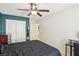Comfortable bedroom featuring a closet, a ceiling fan, and an ensuite bathroom at 7407 Bakewell Ave, Las Vegas, NV 89179