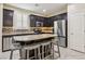 Well-equipped kitchen featuring stainless steel appliances, granite countertops, a large island, and ample storage at 7407 Bakewell Ave, Las Vegas, NV 89179