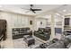 Modern living room featuring a large TV, recessed lighting, and comfortable leather seating at 7407 Bakewell Ave, Las Vegas, NV 89179