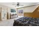 The main bedroom with carpet, ceiling fan, and slider leading to outdoor patio at 7407 Bakewell Ave, Las Vegas, NV 89179