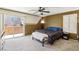 Comfortable main bedroom featuring carpet, a ceiling fan, and access to a private outdoor patio at 7407 Bakewell Ave, Las Vegas, NV 89179
