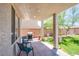 Covered back patio with seating, a barbeque and view of backyard at 7445 Mezzanine View Ave, Las Vegas, NV 89178