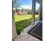 Large backyard with green lawn, stone walkway, and an outdoor pergola at 7445 Mezzanine View Ave, Las Vegas, NV 89178