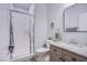 Bathroom featuring a glass-enclosed shower, granite countertop, and modern fixtures at 7445 Mezzanine View Ave, Las Vegas, NV 89178