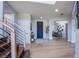 Spacious entryway with hardwood floors and staircase leading to the second floor at 7445 Mezzanine View Ave, Las Vegas, NV 89178