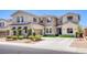 Beautiful two-story home with a stone facade and manicured front yard at 7445 Mezzanine View Ave, Las Vegas, NV 89178