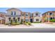 Inviting two-story home with decorative shutters and meticulously trimmed landscaping at 7445 Mezzanine View Ave, Las Vegas, NV 89178