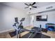 Bright gym area featuring hardwood floors, a ceiling fan and workout equipment at 7445 Mezzanine View Ave, Las Vegas, NV 89178