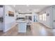 Bright kitchen featuring a large center island, stainless appliances, and white cabinetry at 7445 Mezzanine View Ave, Las Vegas, NV 89178