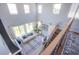 Elevated view of a living room with high ceilings, large windows, and contemporary furniture at 7445 Mezzanine View Ave, Las Vegas, NV 89178