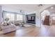 Living room showcasing hardwood floors, neutral walls and an open staircase at 7445 Mezzanine View Ave, Las Vegas, NV 89178
