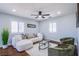 Comfortable living room featuring a sectional sofa, stylish decor, and natural light at 7445 Mezzanine View Ave, Las Vegas, NV 89178