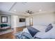 Main bedroom suite featuring hardwood floors, a plush bed, and lots of natural light at 7445 Mezzanine View Ave, Las Vegas, NV 89178