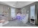 A bedroom is staged with a play area, white furniture, and ample natural light at 746 Horizon Canyon Dr, Henderson, NV 89052