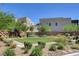A green community park with landscaping and benches between modern home exteriors at 746 Horizon Canyon Dr, Henderson, NV 89052