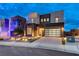 Contemporary home featuring modern architecture, stylish landscaping, and a spacious driveway at 746 Horizon Canyon Dr, Henderson, NV 89052