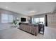 Open-concept living room with tile flooring, modern decor, and a sliding door to outdoor patio at 746 Horizon Canyon Dr, Henderson, NV 89052