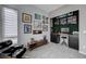 Modern home office featuring ample artwork, a comfortable chair, and a built-in bar at 746 Horizon Canyon Dr, Henderson, NV 89052