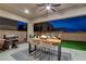 Relaxing outdoor patio with a built-in grill, dining table, and ceiling fan at 746 Horizon Canyon Dr, Henderson, NV 89052