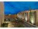 Stylish side yard with artificial turf, desert landscaping, and artistic privacy screens at 746 Horizon Canyon Dr, Henderson, NV 89052
