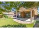 Wonderful backyard with brick landscaping, covered patio, and a swing set at 7652 Silver Baron Rd, Las Vegas, NV 89179