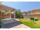 Wonderful backyard with brick landscaping, covered patio, and a swing set at 7652 Silver Baron Rd, Las Vegas, NV 89179