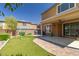 Wonderful backyard with brick landscaping, covered patio, and a swing set at 7652 Silver Baron Rd, Las Vegas, NV 89179