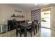 Dining area showcasing a table, chairs, modern decor, and access to the outdoors at 7652 Silver Baron Rd, Las Vegas, NV 89179