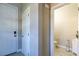 Inviting entryway featuring a white front door and access to a conveniently located half bathroom at 7652 Silver Baron Rd, Las Vegas, NV 89179