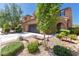 Charming two-story home featuring a desert landscape, a driveway, and a two car garage at 7652 Silver Baron Rd, Las Vegas, NV 89179