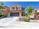 Charming two-story home featuring a desert landscape, a driveway, and a two car garage at 7652 Silver Baron Rd, Las Vegas, NV 89179