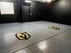 Spacious garage with metallic grey epoxy floor and Las Vegas Golden Knights logo at 7652 Silver Baron Rd, Las Vegas, NV 89179