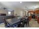 Open-concept living space with a dining area, kitchen, and living room at 7652 Silver Baron Rd, Las Vegas, NV 89179